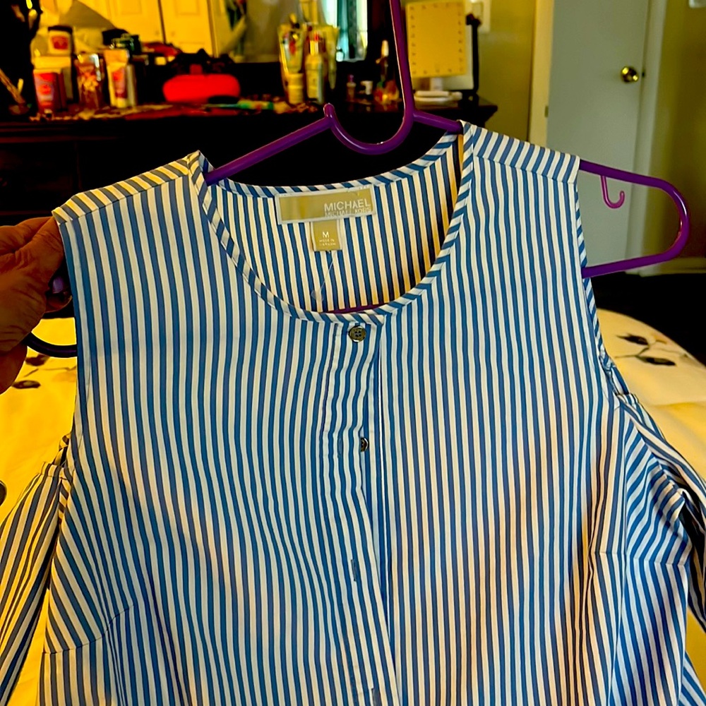 Selling medium size cut out shirt in blue and white